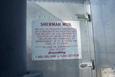 Sherman Mountain sign with legal warnings.