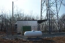 The equipment building and generator for the tower.