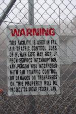 This sign identifies the towers as being used in FAA air traffic control.