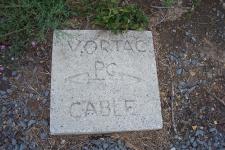 One of several concrete markers labeled VORTAC PC CABLE