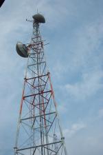 A microwave tower with two dishes.